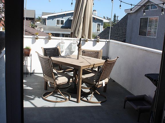 Glass sliders lead to deck.
