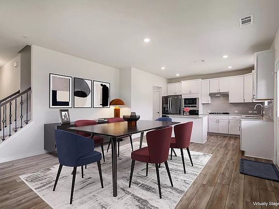 Spacious open-concept layout with plenty of room for a dining table, bar seating, and a comfortable living area.