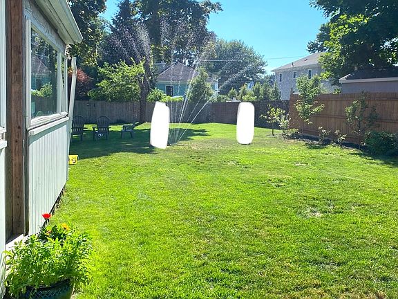 View of back yard- grassy area and garden