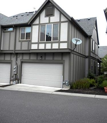 Back of home - entrance into double-car garage by remote con