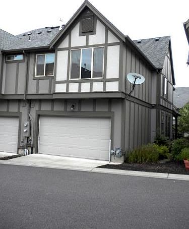 Back of home - entrance into double-car garage by remote con