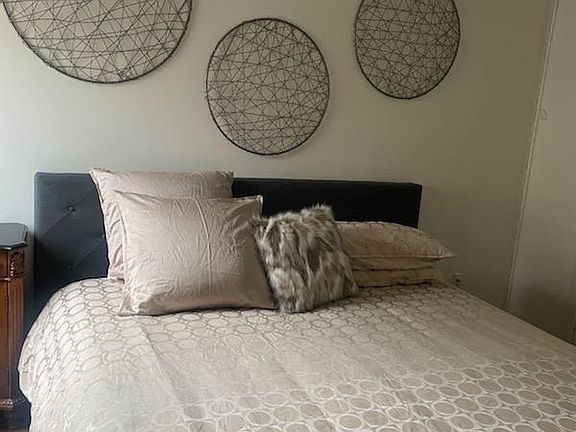King size bed and walk in closet in the master bedroom.