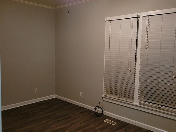 Bedroom #1 with ceiling fan and windows.