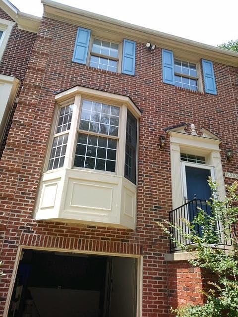 Front exterior - all brick; one car garage and small storage