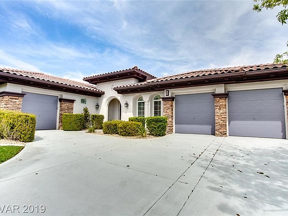 Beautiful Stacked Stone accents adorn the garages.