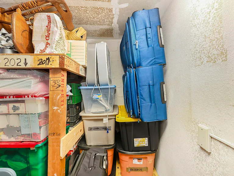 Condo comes with floor to ceiling storage spot on 1st floor of building in shared storage room with other occupants