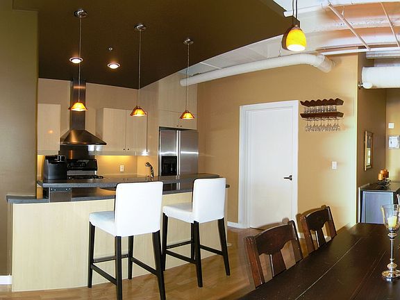Focal point of the unit is the dramatic kitchen that opens to the living area.