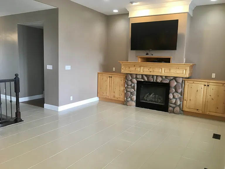 Second photo of living room with new epoxy coated tile flooring.