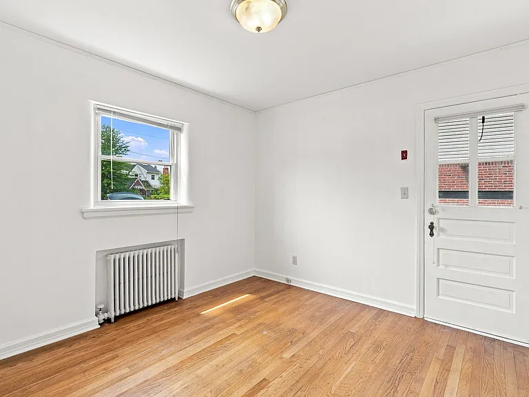 dining room with a second door towards garage driveway