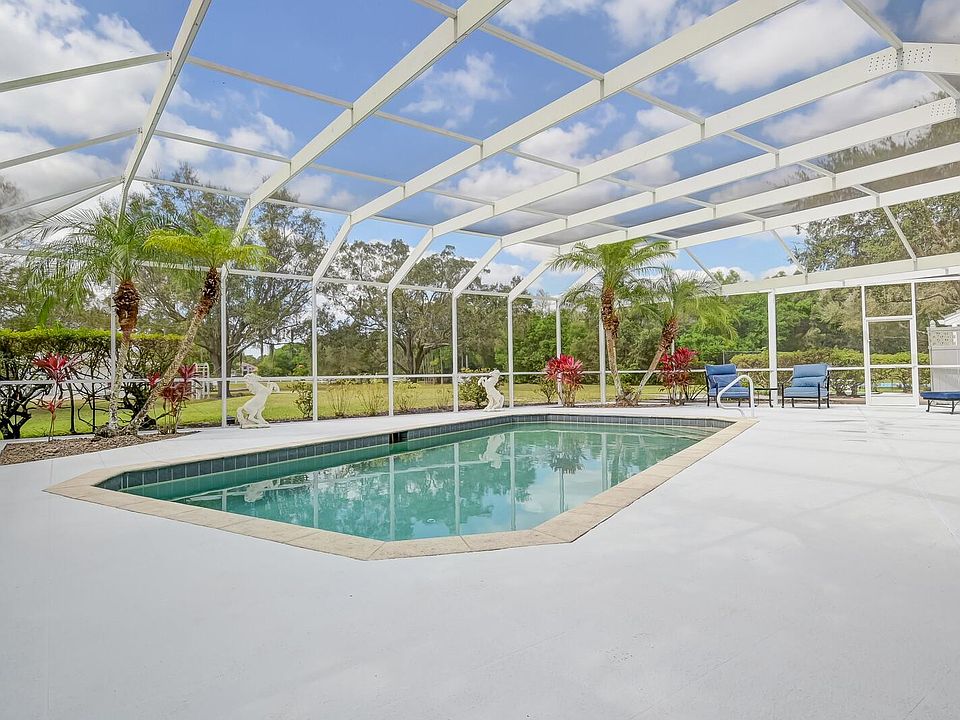 Open pool area with views of the pond