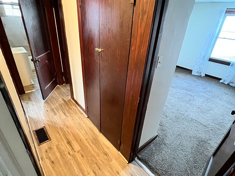 Hallway with both bedrooms and bathroom