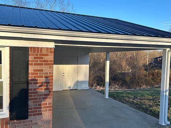 ATTACHED CARPORT & STORAGE ROOM