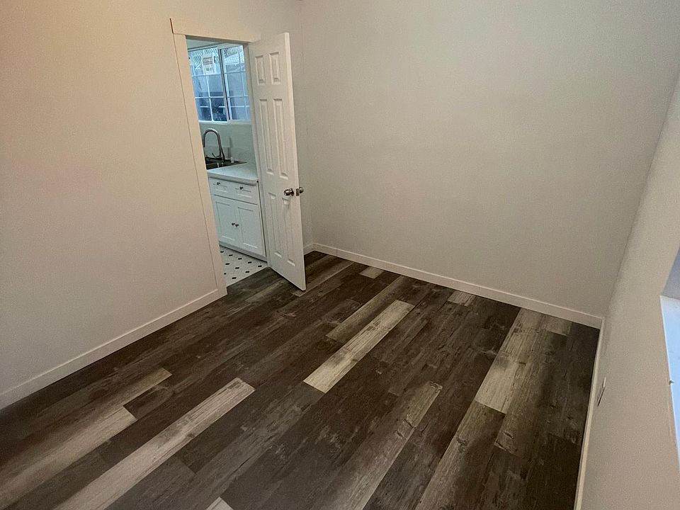 Bedroom with view of the kitchen