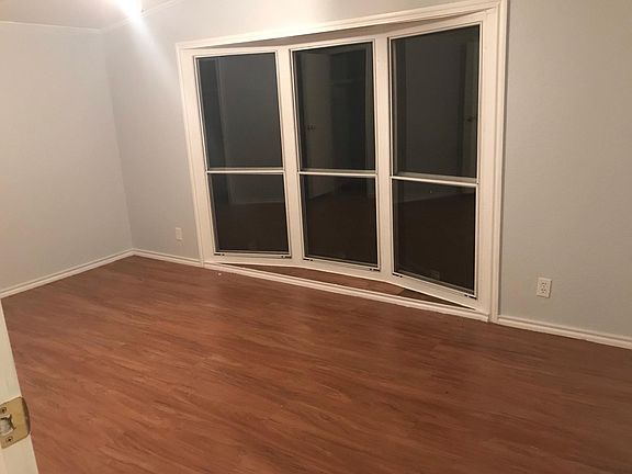 End bedroom ( not master). Floor to ceiling windows let you lay in bed while looking out to natural green space. No neighbors to see? Just mother nature