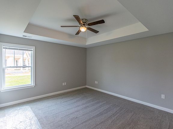 Master Bedroom featuring Tray Ceiling