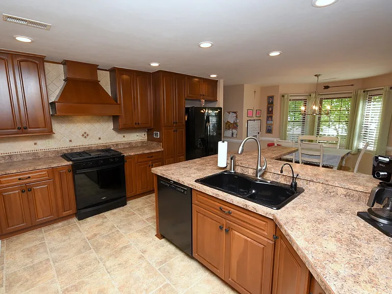 Kitchen with gas range.