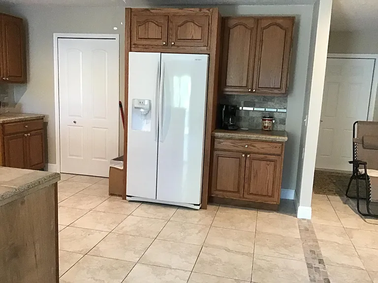 Laundry/pantry area door to left