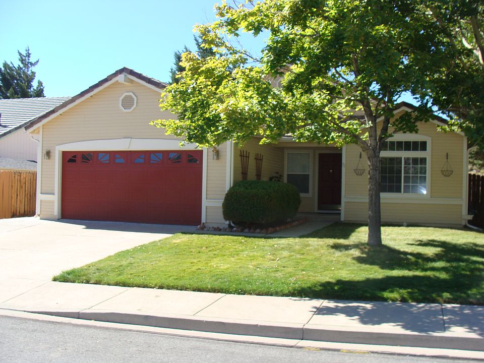 Home Front Yard. 2 Large Trees and just the right amount of grass. 2 car garage and large driveway. Home has new Luxury Plank Flooring, Stainless Steel Appliances, Paint and Lighting