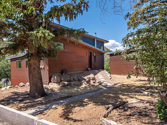 3 acre property with 2 car garage and detached restored barn