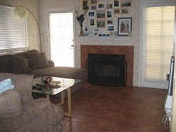 Large living room, neutral tile throughout