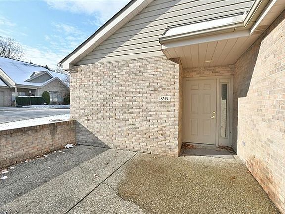 The large patio has room for a table, chairs, and a grill.