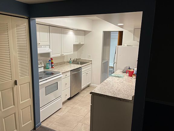 Galley kitchen with new cabinets.