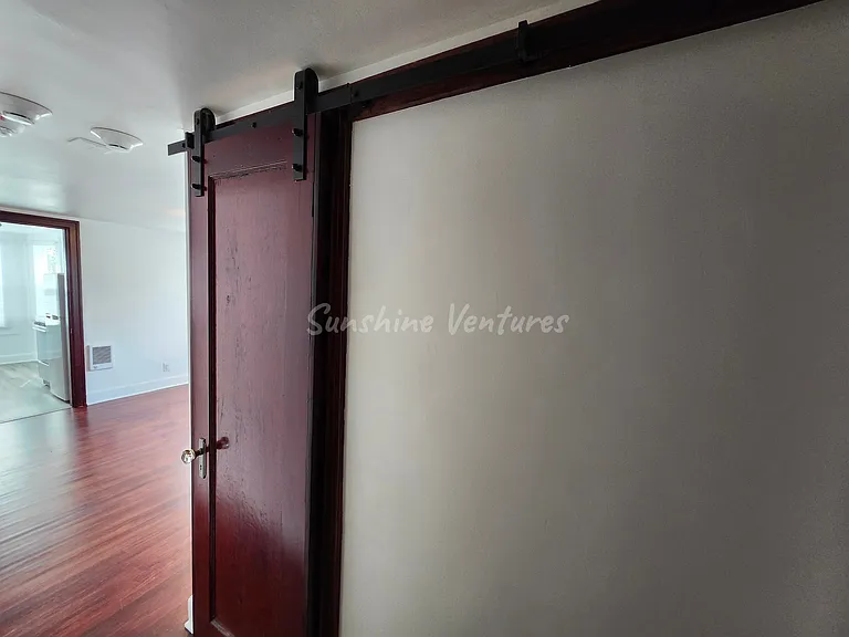 Sliding restored bathroom door