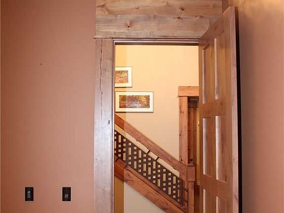 Artsts Glass above the solid 8 panel den door. 