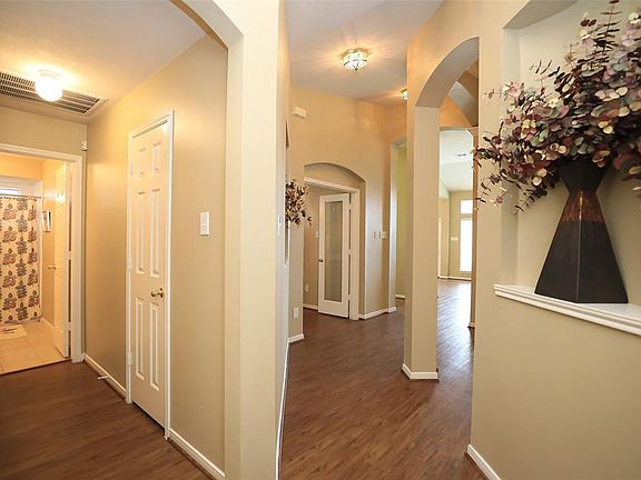You can see the hallway on the left leading to the second bath. Also, here is one of several art niches to accommodate whatever you would like to display.