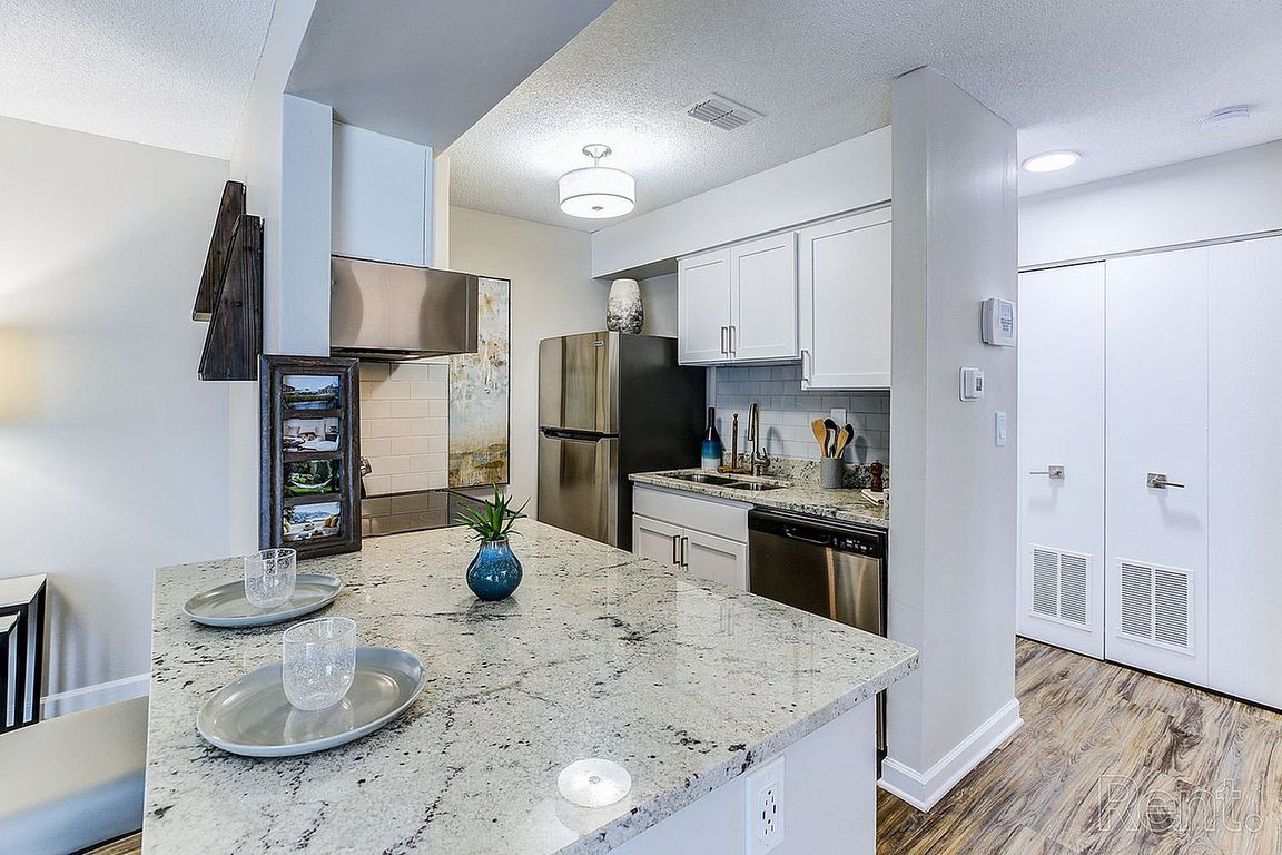 Kitchen with granite counters and modern cabinetry