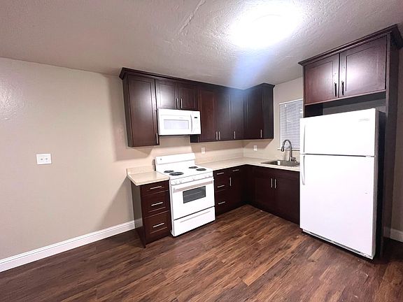 Remodeled Kitchen with Stone Counter Tops and New Luxury Flooring