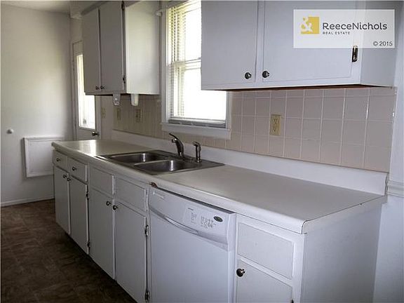 One view of Walk Thru Kitchen with door to Deck & Patio.