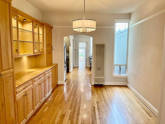 View from dining room into kitchen and bonus space.