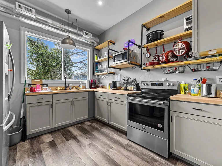 Kitchen is open and spacious. Stove has built in air frier and fridge has both a water purification and filtration systems.