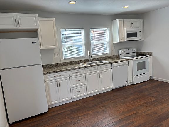 kitchen with dishwater, oven, microwave