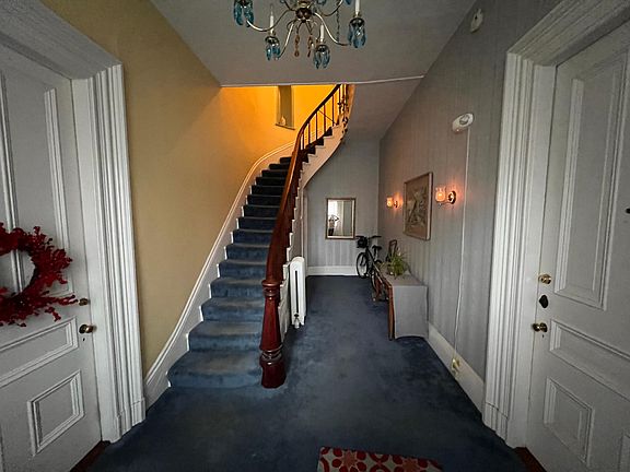 main entry way with apartments 1 on the left and 2 on the right. Apartment 3 & 4 are up stairs