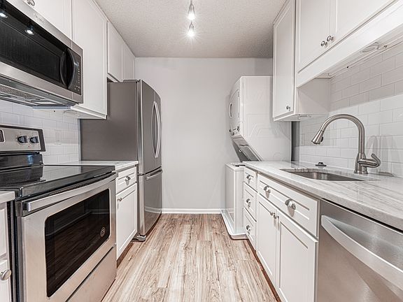 Kitchen view - includes washer/drier in the right corner