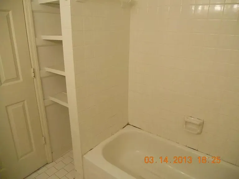 guest bedroom with private bathroom and closet