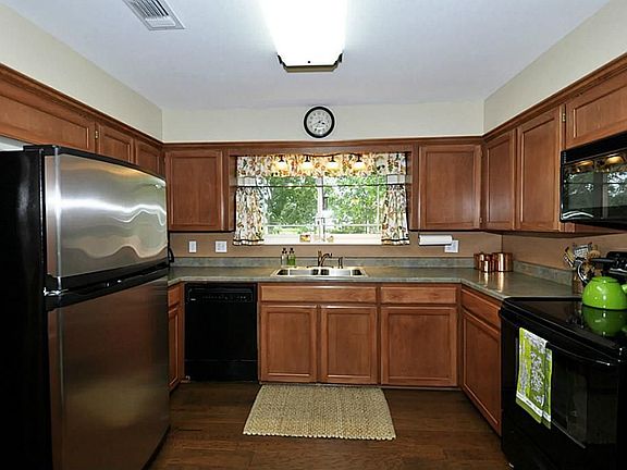 This lovely home has been updated with custom cabinets, hand scraped hardwoods, recent paint, updated appliances.