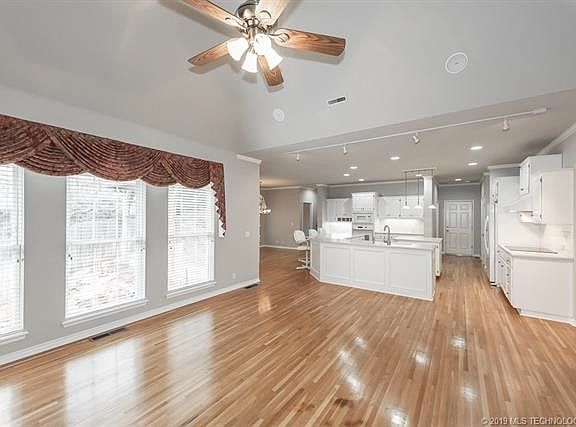 Great room looking into large kitchen with lots of counter space to cook