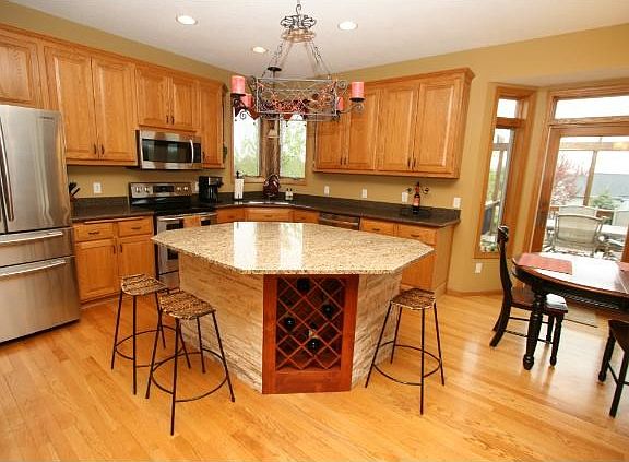 Gorgeous kitchen features Stainless Steel appliances, Granite and Silestone Countertops, Abundance of cabinetry, Oversized Island w/ beautiful stone and so much more!