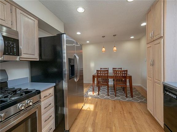 Modern kitchen with stylish cabinetry, updated flooring and stainless appliances.