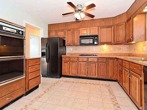 Updated kitchen with double wall ovens, fridge,built-in microwave,gas cook top