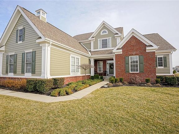 As you enter the cul de sac, this is the view of the home; professional landscaping complements the appeal!
