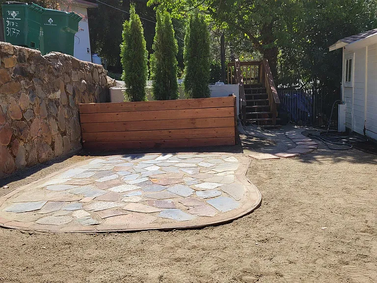 Stone patio in the back yard for the cottage only; it is not shared. Yard is not fenced in the back.