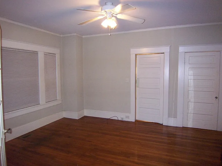 Bedroom with door on right to bathroom