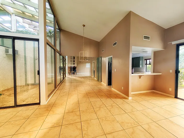 Dining room overlooking the atrium. Breakfast bar off of kitchen.