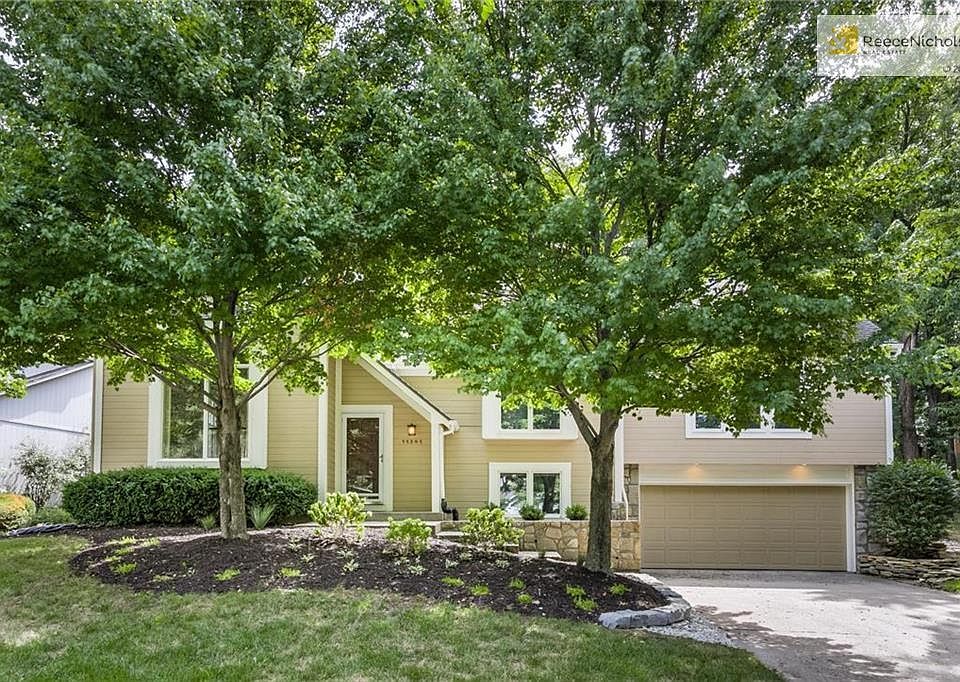 Tucked back on a road that ends, this one-owner home has beautiful landscaping and a LONG driveway!