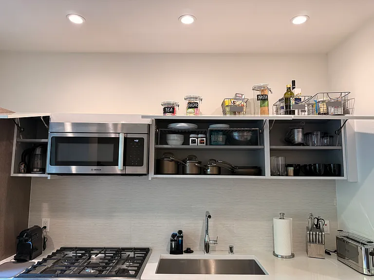 All these items stay in the unit for your cooking and serving needs. Additional items are located under the sink.