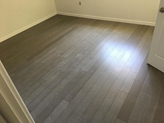 Solid vertical strand real bamboo wood flooring in both bedr
